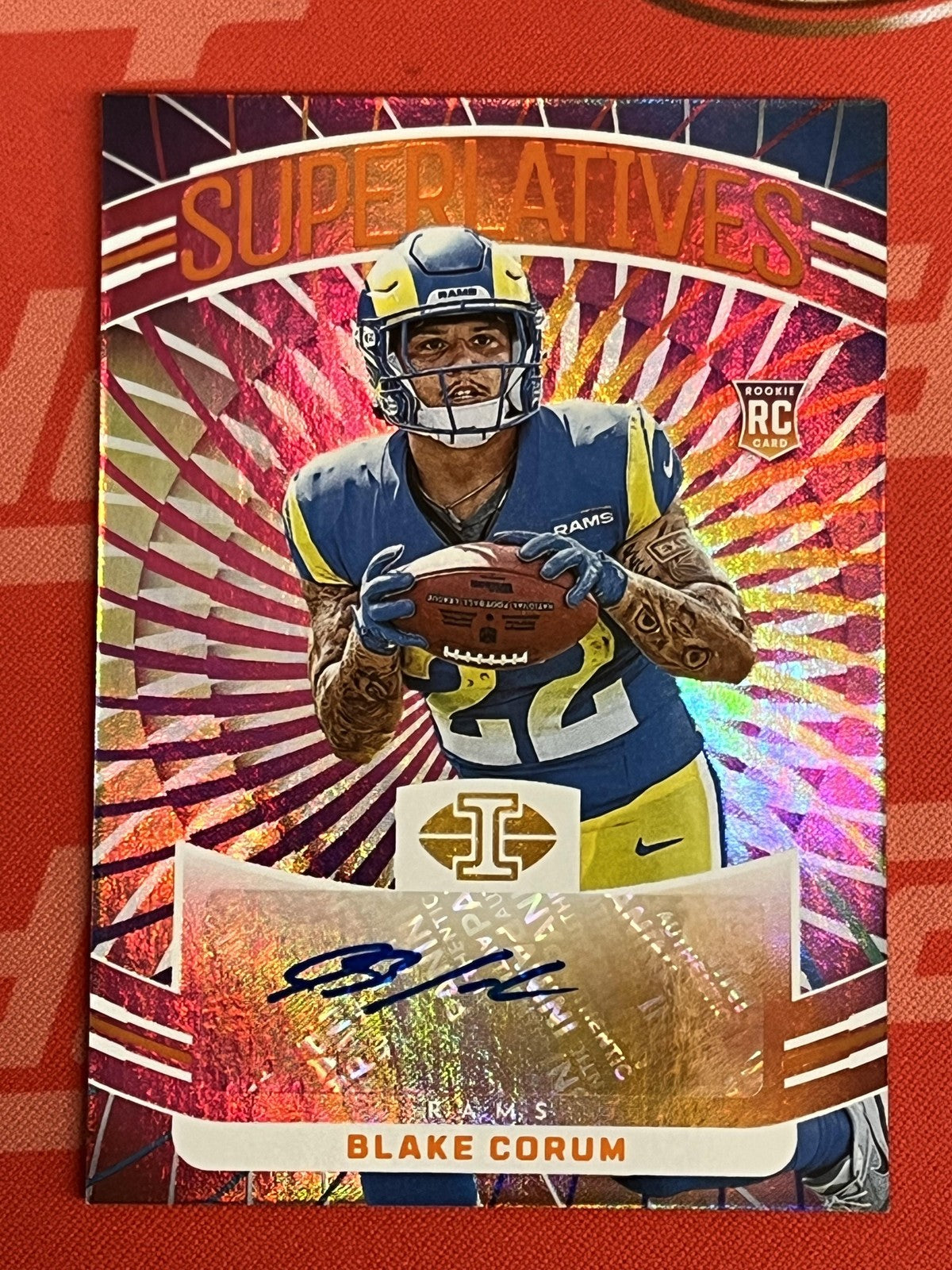 2024 Panini Illusions Superlatives Orange #S-BCM Blake Corum Auto Rams