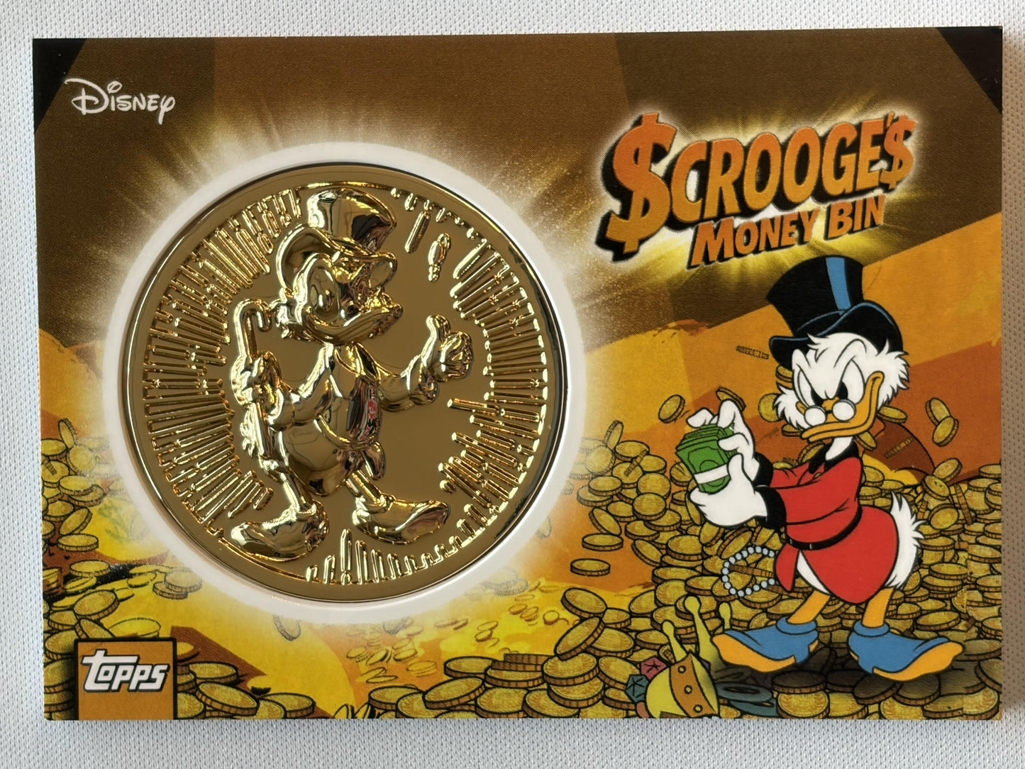 2026 Topps Disney Neon # Scrooges Money Ben Gold SSP