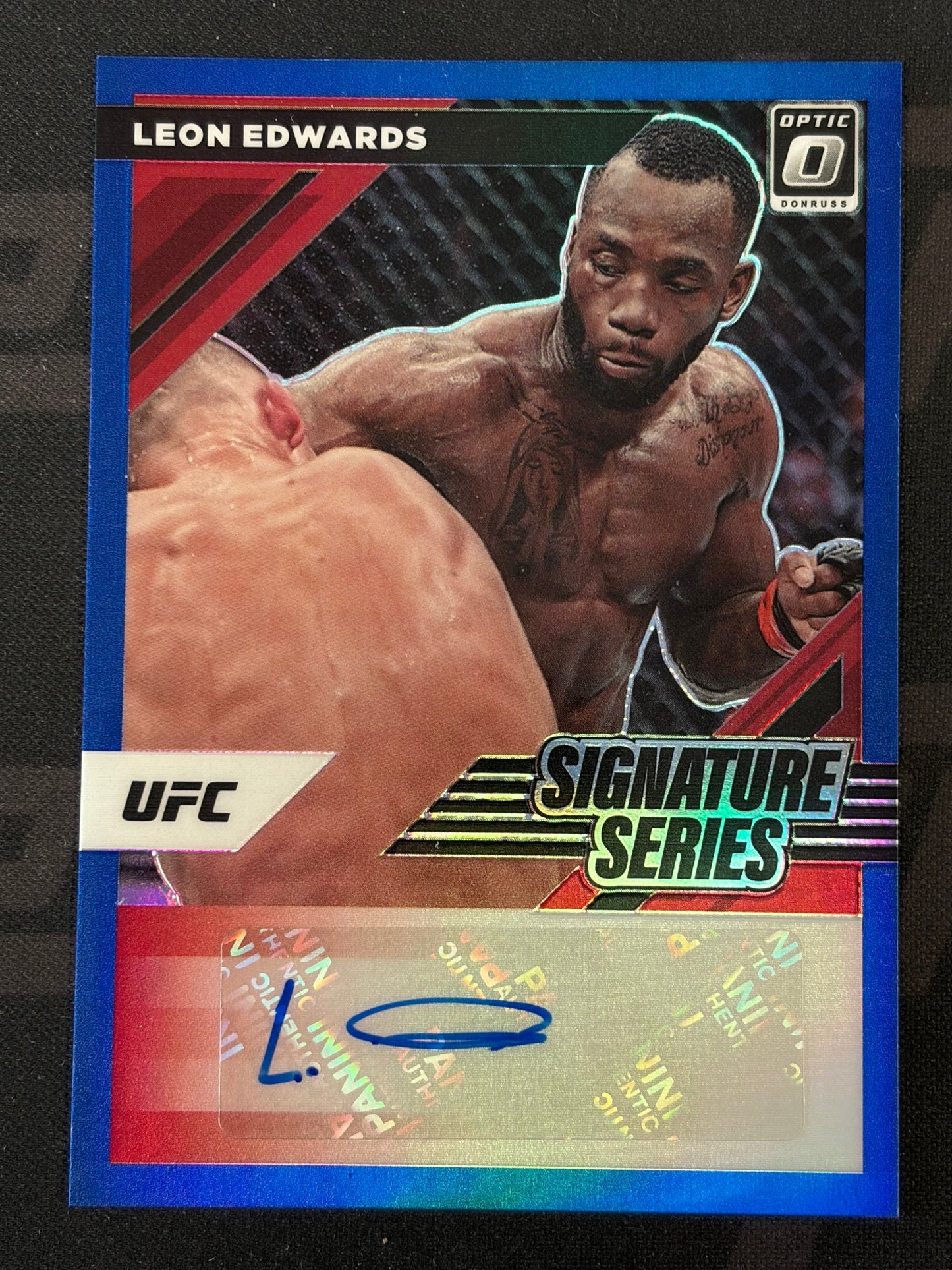 2022 Donruss Optic UFC Signature Series Blue #SS-LEW Leon Edwards AU #/25